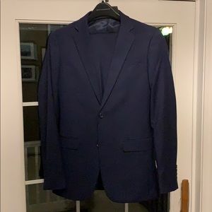 Men’s Wearhouse slim fit suit.